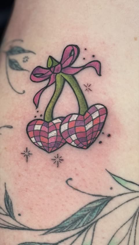 Checkered cherry hearts tattoo tied with a pink bow, full color, with sparkle accents