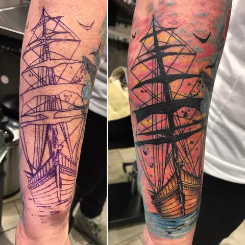 Tall ship tattoo shown as linework and finished with a watercolor sunset sky, on a forearm