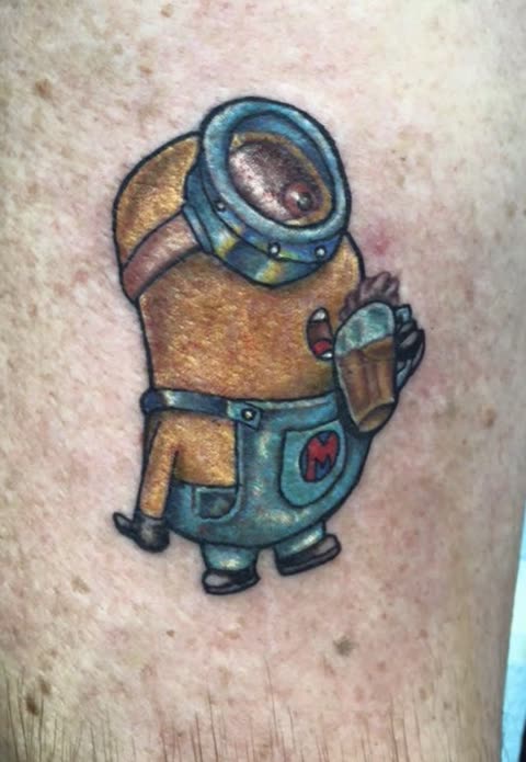 Cartoon minion tattoo holding a beer mug, full color